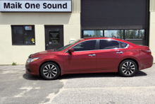 Black 2015 Nissan Altima with dark privacy window tint